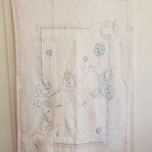 Vintage baby crib quilt with a hand-stitched circus theme 32.5" x 49"